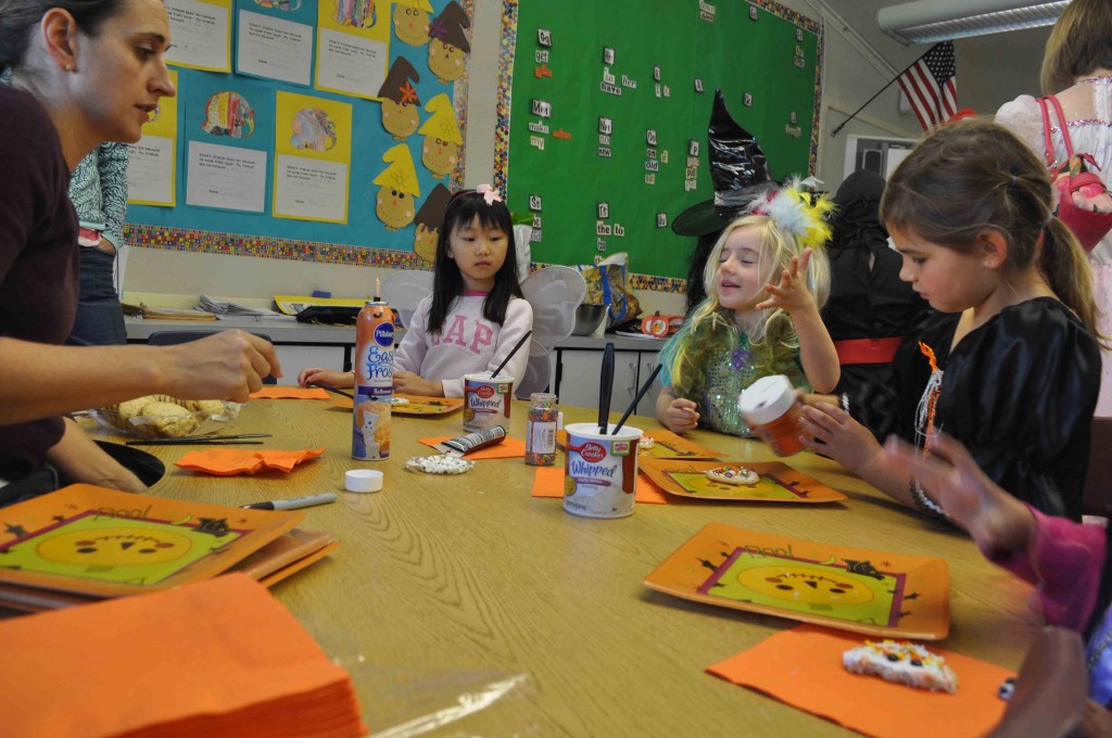 Parents helping kids in the classroom