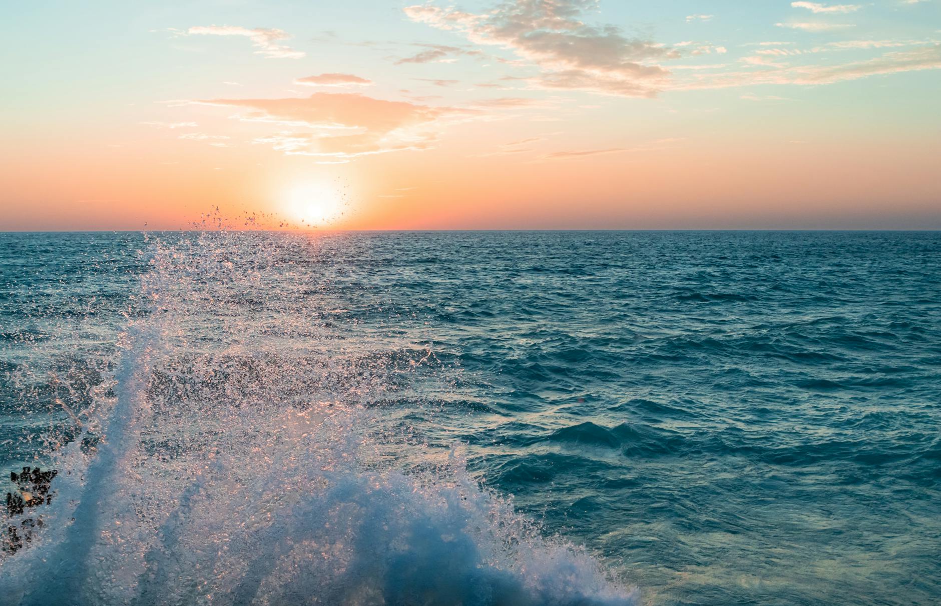 stunning sunset over lake michigan with splashing waves