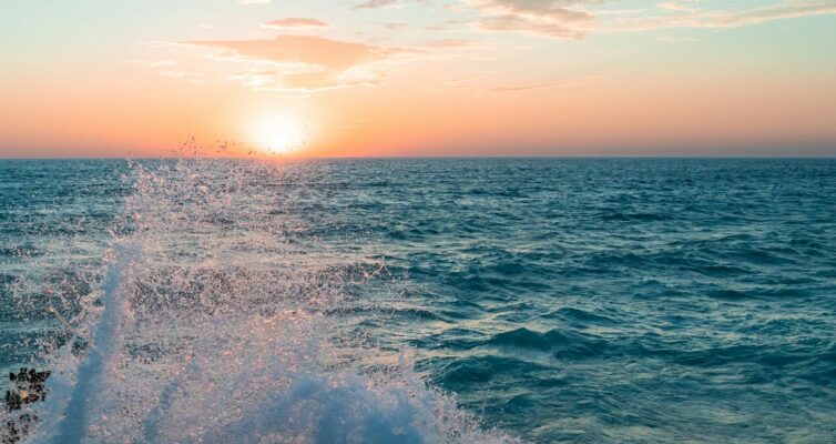 stunning sunset over lake michigan with splashing waves