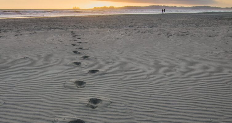 foot prints in gray sand