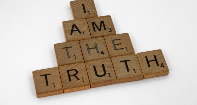 scrabble tiles on a white surface
