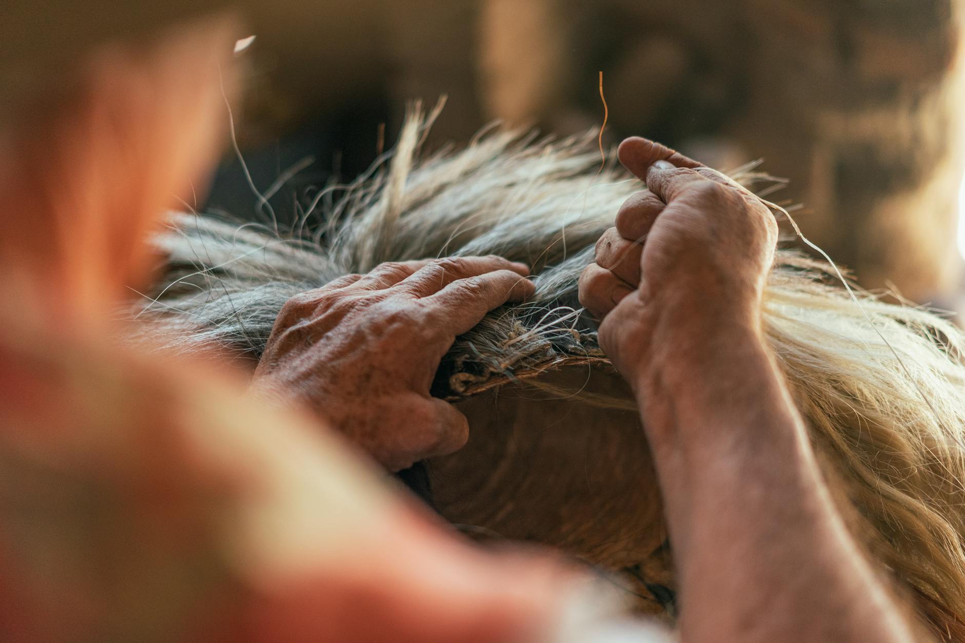 close up of artisan working with hair