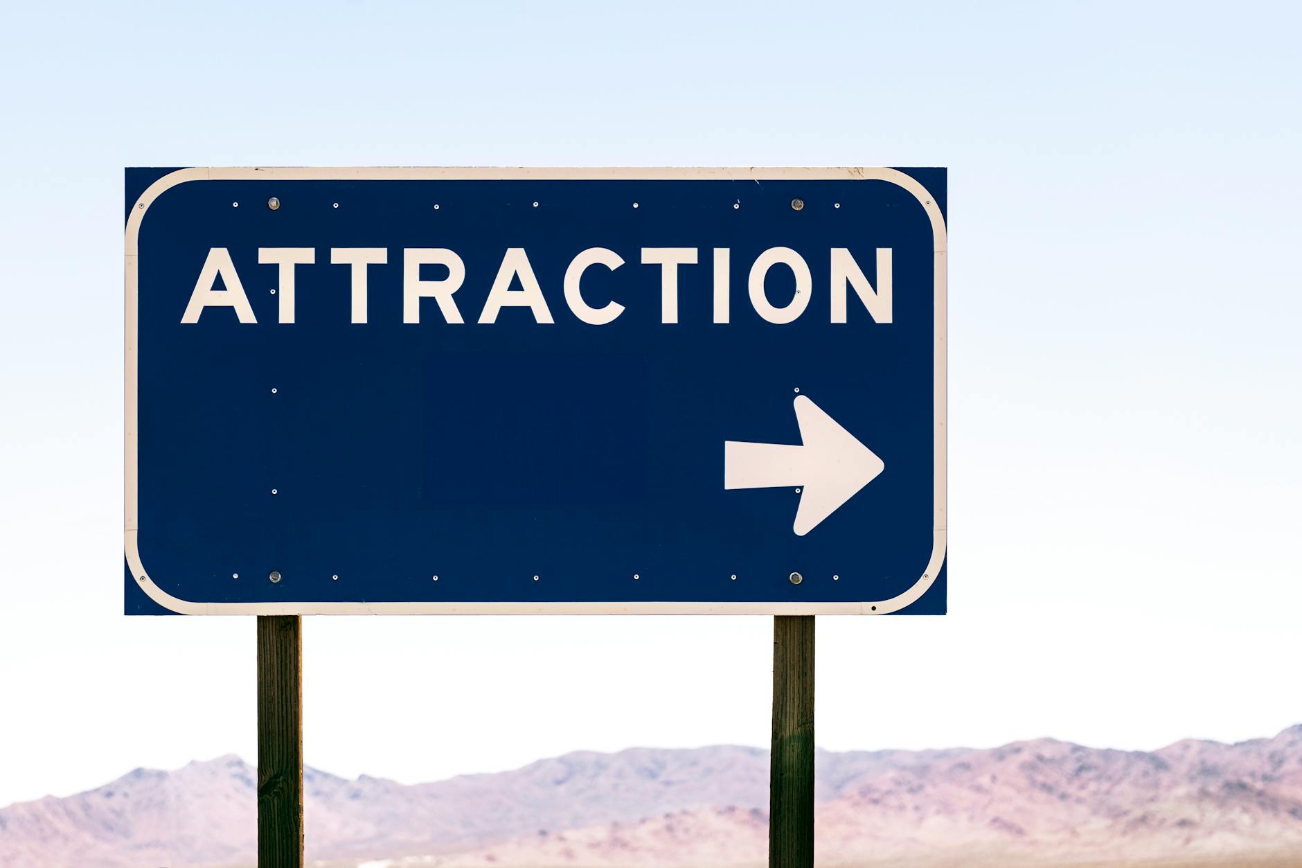 sign arrow attraction text